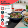 Blue non-stick frying pan with steak, showing PFAS-free, induction-suitable features