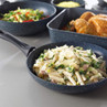 Pasta with creamy sauce, chicken and parmesan served in a non-stick frying pan