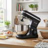 Black stand mixer with stainless steel bowl on kitchen worktop, set up for baking