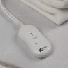 Kleeneze heated blanket controller showing slider on white mattress