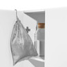 Grey drawstring storage bag hanging in white cupboard, next to sealed jar.