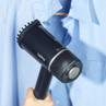 Person attaching handle to dark blue handheld garment steamer