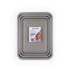 Set of three grey stackable baking trays, top-down view.