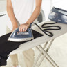 Beldray steam generator iron in use on ironing board with black shirt