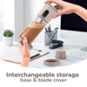 Personal blender with coffee inside in a home office, grey interchangeable storage lids shown