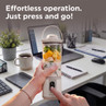 Portable blender with fruit, shown in a modern office, promoting easy use.
