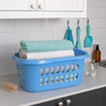 Blue laundry basket with folded towels on kitchen worktop