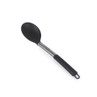Silver and black serving spoon beside plate of garlic bread and spaghetti in tomato sauce