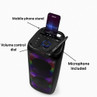 Black portable party speaker with phone stand, volume dial and included microphone.