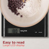 Black digital kitchen scale with bowl showing flour and chocolate chips, large LCD display