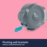 Grey retractable washing line unit with blue cord and pivoting wall bracket, on pink background