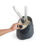 Hand adjusting control dial on grey Beldray garment steamer base