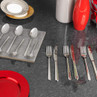 Silver cutlery set displayed on dark countertop, includes forks, knives and spoons.