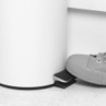 Foot pressing pedal bin, demonstrates hands-free bin use