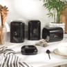 Set of black kitchen canisters for tea, coffee and sugar, styled with mugs and utensils.