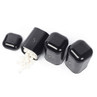 Set of three black kitchen canisters labelled S, T, and C; one open with sugar cubes spilling out