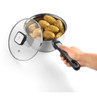 Stainless steel saucepan with glass lid, held by hand, filled with cooked potatoes