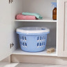 Blue laundry basket with lid in cupboard
