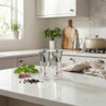Set of two clear and silver salt and pepper grinders on kitchen worktop