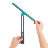 Grey and teal window squeegee with adjustable handle, shown held in use.