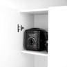 Black Progress deep fat fryer stored on white kitchen cupboard shelf