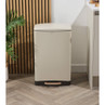Cream pedal bin with rose gold foot pedal in modern kitchen setting