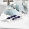 Pack of 2 blue handled cleaning brushes for bottles and dishes on kitchen counter