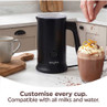 Black Salter milk frother in kitchen, next to hot chocolate with cream.