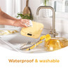 Yellow kitchen scale being washed under running tap