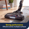 Vacuum cleaner head cleaning wood floor and carpet, highlighting multi-surface effectiveness