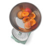 Kitchen scale with apricots in stainless steel bowl, shown from above.