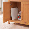 White bathroom scale stored in wooden cabinet, shown with towels and toiletries