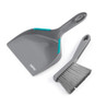 Grey dustpan and brush set with turquoise grips, shown on white background