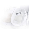 White textured bath pillow in a modern bathtub with handheld shower, shown in use.