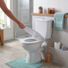 White close-coupled toilet with soft-close seat in a modern bathroom