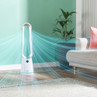 White bladeless tower fan operating in a modern living room
