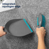 Grey dustpan and turquoise brush set, showing integrated squeegee edge on carpet