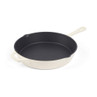 Cream cast iron frying pan with handle and side grip, shown from above.