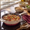 Cream cast iron casserole dish on hob with cooked chicken and vegetables