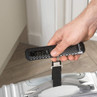 Black digital luggage scale weighing a suitcase, shown in hand