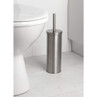 Silver stainless steel toilet brush holder in bathroom next to toilet