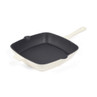 Cream square cast iron grill pan with handle, shown at angle.