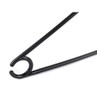 Black plastic safety pin, close-up showing ridged detail and curved clasp.