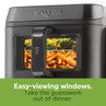 Close-up of Salter air fryer with fries visible through easy-viewing window.