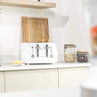 White Salter toaster with two slices of bread in a modern kitchen setting
