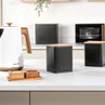Black kitchen canister with wood lid on counter, modern style, suitable for tea, coffee or sugar