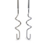 Pair of stainless steel dough hooks for electric mixer, close-up.