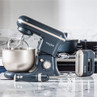 Salter grey and gold stand mixer, hand mixer and stick blender on kitchen counter