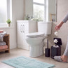 White close-coupled toilet in a modern bathroom