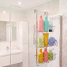 Chrome over-door shower caddy with three baskets holding toiletries
